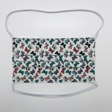 Load image into Gallery viewer, Made with three layers of 100% quilting-weigh cotton and features a butterfly print. This mask includes a filter pocket located in the pleats in the back of the mask for a filter of your choice. This mask has elastic head bands and also has a bendable aluminum nose piece. Machine wash and dry after each use. 7” H x 7.5” W