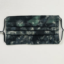 Load image into Gallery viewer, Made with three layers of dark green on black print 100% quilting cotton, this mask includes a filter pocket located in the pleats in the back of the mask for a filter of your choice, adjustable elastic ear loops and a bendable aluminum nose. Machine wash and dry after each use. 7” H x 7.5” W