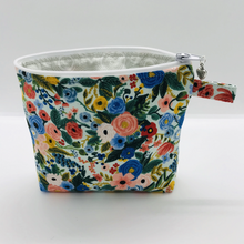 Load image into Gallery viewer, The pouch is made of 100% quilting cotton from Rifle Paper Co and features a multicolored woodland floral print and a layer of fleece for stability. The cute metal tassel gives an added touch. 6”W x 4.5” H x 1”D. Machine washable and dryer safe, or air dry.