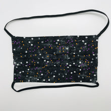 Load image into Gallery viewer, Made with three layers of small white, gold and purple dots on black print 100% quilting cotton, this mask includes a filter pocket located in the pleats in the back of the mask for a filter of your choice, over the head elastic loops and a bendable aluminum nose. Machine wash and dry after each use. 7” H x 7.5” W
