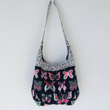 Load image into Gallery viewer, Light weight and roomy this tote is made of soft and smooth Art Gallery butterfly print cotton, and lined with Essex cotton/linen from Robert Kaufman. The inner compartment has a magnetic snap and inner pocket. 15.5” W & 14”H Total length with strap 33"