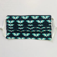 Load image into Gallery viewer, 100% quilting-weight blue and green animal themed cotton face mask with adjustable elastic ear loops and bendable nose piece. Washable, reusable fabric face mask. Wash in washing machine and dry in dryer after each use. 7” H x 7.5” W Butterflies in Ultra Marine - Pacific Collection - Elizabeth Hartman (designer)-Robert Kaufman Fabrics