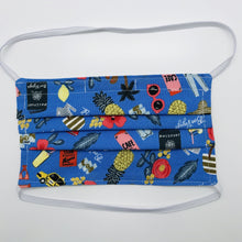 Load image into Gallery viewer, Made with three layers of blue travel themed print 100% quilting cotton, this mask includes a filter pocket located in the pleats in the back of the mask for a filter of your choice, elastic head bands and a bendable aluminum nose. Machine wash and dry after each use. 7” H x 7.5” W
