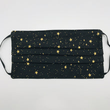 Load image into Gallery viewer, Masks are made of 2 layers of 100% quilting cotton featuring Rifle Paper Co Metallic Gold Stars on Black print. The elastic adjustable ear loops fit a wider range of size and also have a bendable aluminum nose. Machine wash and dry after each use. 7” H x 7.5” W