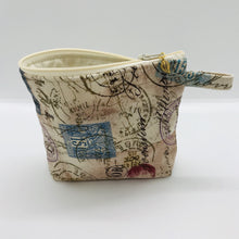 Load image into Gallery viewer, The small pouch is made from 100% tan antique stamp print and has a layer of fleece for structure and a cute metal tassel. The pouch design is from the Becca Bags pattern from Lazy Girl Design. 6”W x 4.5” H x 1”D. Machine washable and dryer safe or air dry.