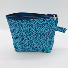 Load image into Gallery viewer, The small pouch is made from 100% blue/teal vine maze print and has a layer of fleece for structure and a cute metal tassel. The pouch design is from the Becca Bags pattern from Lazy Girl Design. 6”W x 4.5” H x 1”D. Machine washable and dryer safe or air dry.