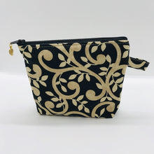 Load image into Gallery viewer, The small pouch is made from 100% gold swirls on black print and has a layer of fleece for structure and a cute metal tassel. The pouch design is from the Becca Bags pattern from Lazy Girl Design. 6”W x 4.5” H x 1”D. Machine washable and dryer safe or air dry.