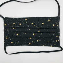 Load image into Gallery viewer, Masks are made of 2 layers 100% quilting cotton featuring a metallic gold stars on black print, over the head elastic loops and a bendable aluminum nose. Wash in washing machine and dry in dryer after each use. 7” H x 7.5” W. Rifle Paper Co designs.
