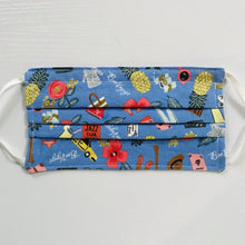 Load image into Gallery viewer, Made with three layers of blue travel themed print 100% quilting cotton, this mask includes a filter pocket located in the pleats in the back of the mask for a filter of your choice, adjustable elastic ear loops and a bendable aluminum nose. Machine wash and dry after each use. 7” H x 7.5” W