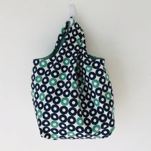 Load image into Gallery viewer, The tote is made of 100% quilting-weight blue, green and white record shapes print cotton and is fully lined. Machine washable and dryable or hang dry. Size: 17” x 21”. Fabric from Rotary Club collection by Cotton + Steel