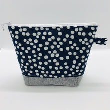 Load image into Gallery viewer, The pouch is made from 100% quilting cotton with a white dots on blue print, Kaufman Essex cotton/linen for the base, and a layer of fleece. The cute metal tassel gives an added touch. 7.5 W x 6”H x 2.5”D. Machine washable and dryer safe, or air dry.