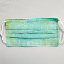 Load image into Gallery viewer, Made with three layers green, white and yellow textured colored print 100% quilting cotton, this mask includes a filter pocket located in the pleats in the back of the mask for a filter of your choice, adjustable elastic ear loops and a bendable aluminum nose. Machine wash and dry after each use. 7” H x 7.5” W