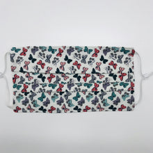 Load image into Gallery viewer, Made with three layers of 100% quilting-weigh cotton and features a butterfly print. This mask includes a filter pocket located in the pleats in the back of the mask for a filter of your choice. This mask has adjustable elastic ear loops and also has a bendable aluminum nose piece. Machine wash and dry after each use. 7” H x 7.5” W