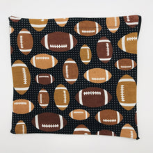 Load image into Gallery viewer, Image of footballs on black cotton print.
