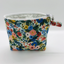 Load image into Gallery viewer, The pouch is made of 100% quilting cotton from Rifle Paper Co and features a multicolored woodland floral print and a layer of fleece for stability. The cute metal tassel gives an added touch. 6”W x 4.5” H x 1”D. Machine washable and dryer safe, or air dry.
