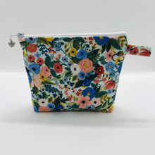 Load image into Gallery viewer, The pouch is made of 100% quilting cotton from Rifle Paper Co and features a multicolored woodland floral print and a layer of fleece for stability. The cute metal tassel gives an added touch. 6”W x 4.5” H x 1”D. Machine washable and dryer safe, or air dry.
