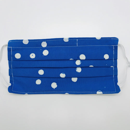 Masks are made of 2 layers of 100% quilting-weight batik white dot on blue cotton. The masks have elastic adjustable ear loops and a bendable aluminum nose piece. Machine wash and dry after each use. 7” H x 7.5” W