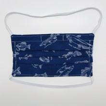 Load image into Gallery viewer, Masks are made of 2 layers 100% quilting cotton featuring a print of white fish on a blue background, over the head elastic loops and a bendable aluminum nose. Wash in washing machine and dry in dryer after each use. 7” H x 7.5” W 
