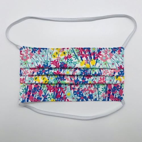 Masks are made of 2 layers of spring flowers print 100% quilting cotton and have behind the head elastic bands. The masks also have a bendable aluminum nose. Wash in washing machine and dry in dryer after each use. 7” H x 7.5” W