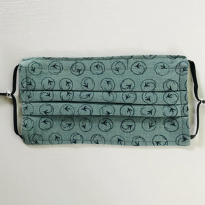 100% quilting-weight blue airplane print cotton face mask with adjustable elastic ear loops and bendable nose piece. Washable, reusable fabric face mask. Wash in washing machine and dry in dryer after each use. 7” H x 7.5” W
