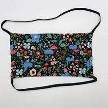 Load image into Gallery viewer, Masks are made of 2 layers 100% quilting cotton featuring a multi colored flowers on black print, over the head elastic loops and a bendable aluminum nose. Wash in washing machine and dry in dryer after each use. 7” H x 7.5” W Rifle Paper Co designs.

