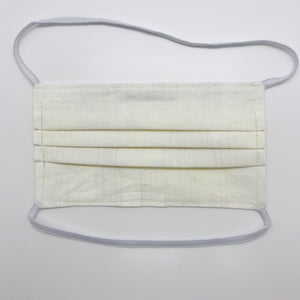 Masks are made of 2 layers 100% quilting cotton featuring a white/cream textured grunge  print, over the head elastic loops and a bendable aluminum nose. Wash in washing machine and dry in dryer after each use. 7” H x 7.5” W 