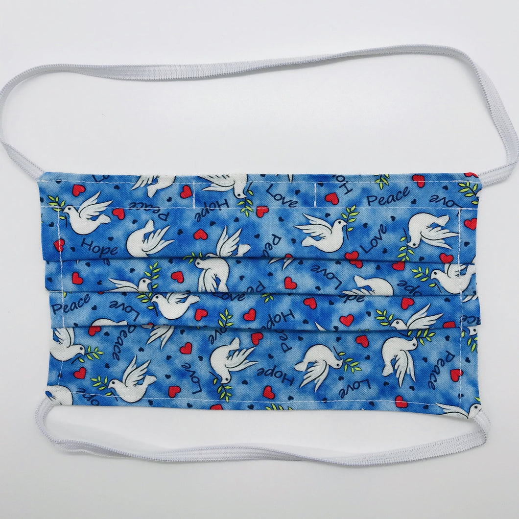 100% quilting-weight cotton blue with white doves print fabric face mask with behind the head elastic bands and bendable nose piece. Washable, reusable fabric face mask. Wash in washing machine and dry in dryer after each use. 7” H x 7.5” W