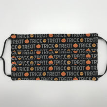 Load image into Gallery viewer, Made with three layers of trick or treat words on orange pumpkins on black print 100% quilting cotton, this mask includes a filter pocket located in the pleats in the back of the mask for a filter of your choice, adjustable elastic ear loops and a bendable aluminum nose. Machine wash and dry after each use. 7” H x 7.5” W

