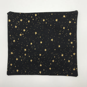 Image of metallic gold stars on black cotton print by Rifle Paper Designs.