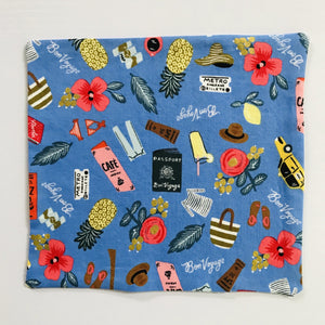 This mask is crafted with two layers of 100% quilting-weight cotton fabric with a blue travel theme and is machine washable and dryable. The adjustable ear loops are made of elastic and tightened with a  bead to make them comfortable to fit a wider range of sizes. The masks also have a bendable aluminum nose piece which helps to make a better seal over the wearers face.  Fabric from the Les Fleurs collection by Rifle Paper co, designed by Ann Rifle Bond.  7” H x 7.5” W