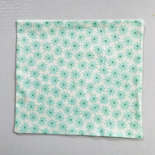 Load image into Gallery viewer, 100% quilting-weight aqua green cotton face mask with twill tape straps and bendable nose piece. Washable, reusable fabric face mask. Wash in washing machine and dry in dryer after each use.  Fabric from the Pond collection by Elizabeth Hartman  7” H x 7.5” W
