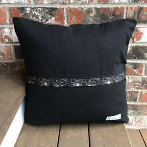 Scrappy Halloween pillow cover, 100% cotton in orange, black and gold prints. The pillow is quilted with a meandering design by machine with 40 wt Aurifil thread and has a hidden zipper in the back made of black Kona Cotton. The pillow cover only is offered and does not include the pillow form insert.  The pillow insert needed is 18 x 18 inches. Machine wash with like colors in cold water with low suds soap such as Woolite, line dry.