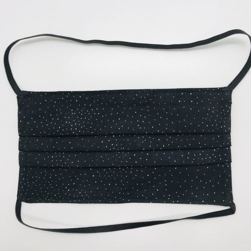 Masks are made of 2 layers 100% quilting cotton featuring a metallic silver sparkle on black print, over the head elastic loops and a bendable aluminum nose. Wash in washing machine and dry in dryer after each use. 7” H x 7.5” W