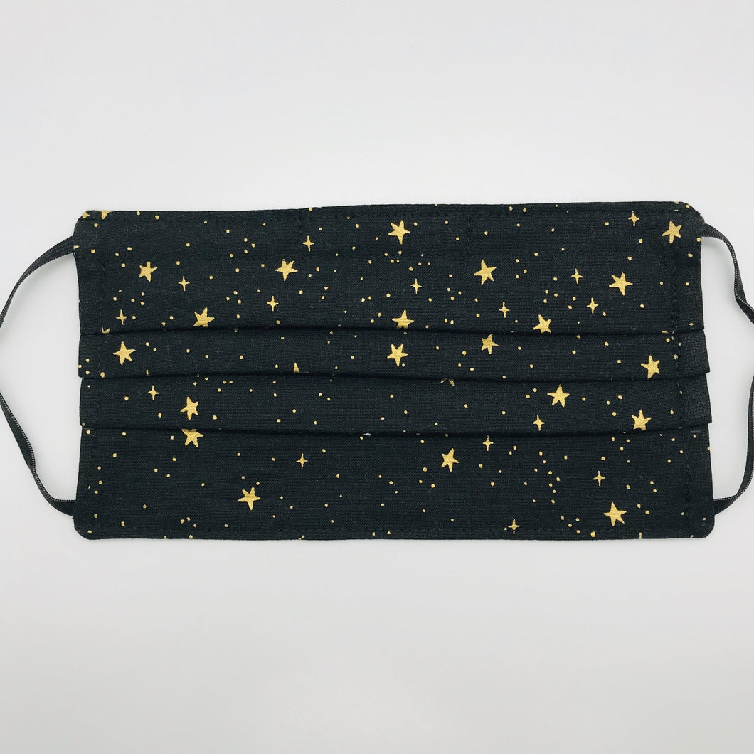 Masks are made of 2 layers of 100% quilting cotton featuring Rifle Paper Co Metallic Gold Stars on Black print. The elastic adjustable ear loops fit a wider range of size and also have a bendable aluminum nose. Machine wash and dry after each use. 7” H x 7.5” W