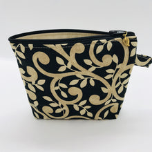 Load image into Gallery viewer, The small pouch is made from 100% gold swirls on black print and has a layer of fleece for structure and a cute metal tassel. The pouch design is from the Becca Bags pattern from Lazy Girl Design. 6”W x 4.5” H x 1”D. Machine washable and dryer safe or air dry.
