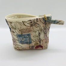 Load image into Gallery viewer, The small pouch is made from 100% tan antique stamp print and has a layer of fleece for structure and a cute metal tassel. The pouch design is from the Becca Bags pattern from Lazy Girl Design. 6”W x 4.5” H x 1”D. Machine washable and dryer safe or air dry.
