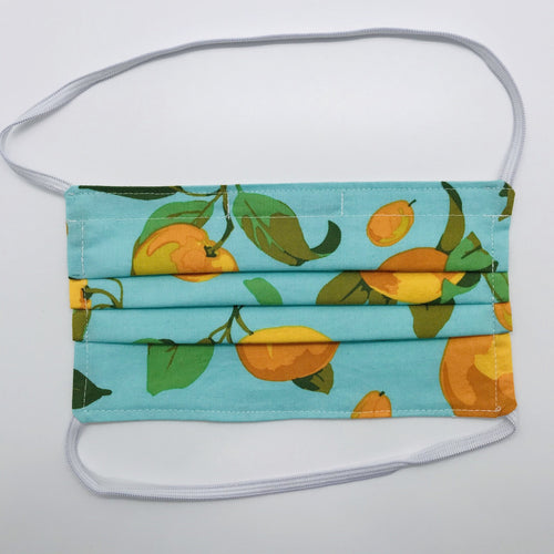 Masks are made of 2 layers of peaches on green/blue print 100% quilting cotton and have behind the head elastic bands. The masks also have a bendable aluminum nose. Wash in washing machine and dry in dryer after each use. 7” H x 7.5” W