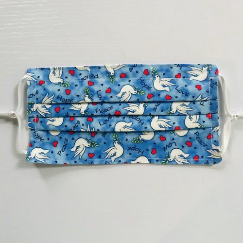 100% quilting-weight cotton, blue with white doves print fabric face mask with adjustable elastic ear loops and bendable nose piece. Washable, reusable fabric face mask. Wash in washing machine and dry in dryer after each use. 7” H x 7.5” 