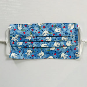 100% quilting-weight cotton, blue with white doves print fabric face mask with adjustable elastic ear loops and bendable nose piece. Washable, reusable fabric face mask. Wash in washing machine and dry in dryer after each use. 7” H x 7.5” 