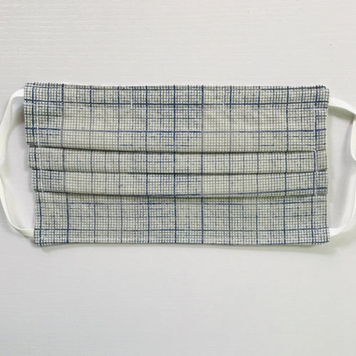 100% quilting-weight cotton novelty themed blue graph print face mask with adjustable elastic ear loops and bendable nose piece. Washable, reusable fabric face mask. Wash in washing machine and dry in dryer after each use. 7” H x 7.5” W  Fabric from the Correspondence collection by Tim Holtz for Coats