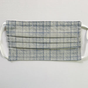 100% quilting-weight cotton novelty themed blue graph print face mask with adjustable elastic ear loops and bendable nose piece. Washable, reusable fabric face mask. Wash in washing machine and dry in dryer after each use. 7” H x 7.5” W  Fabric from the Correspondence collection by Tim Holtz for Coats