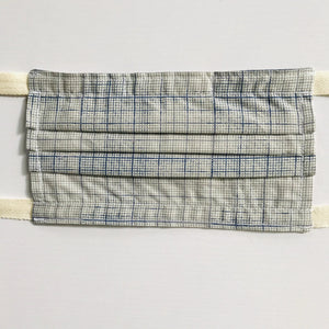 100% quilting-weight cotton novelty themed blue graph print face mask with twill tape straps and bendable nose piece. Washable, reusable fabric face mask. Wash in washing machine and dry in dryer after each use.  Fabric from the Correspondence collection by Tim Holtz for Coats  7” H x 7.5” W