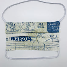 Load image into Gallery viewer, Masks are made of 2 layers 100% quilting cotton featuring a blue and white novelty airplane themed print, behind the head elastic band and a bendable aluminum nose. Wash in washing machine and dry in dryer after each use. 7” H x 7.5” W
