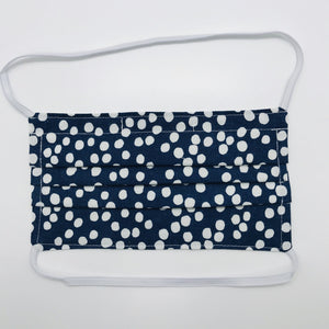Masks are made of 2 layers 100% quilting cotton featuring a white dots on blue print, over the head elastic loops and a bendable aluminum nose. Wash in washing machine and dry in dryer after each use. 7” H x 7.5” W 