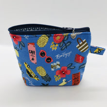 Load image into Gallery viewer, The small pouch is made from 100% blue travel themed print and has a layer of fleece for structure and a cute metal tassel. The pouch design is from the Becca Bags pattern from Lazy Girl Design. 6”W x 4.5” H x 1”D. Machine washable and dryer safe or air dry.
