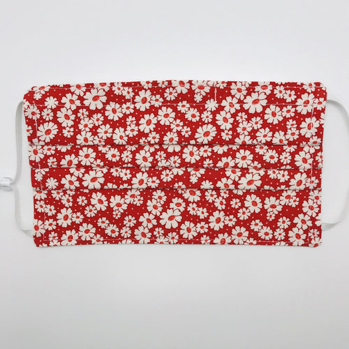Masks are made of 2 layers of 100% quilting-weight cotton fabric with a 30's retro simple daisy's on red print. . The elastic adjustable ear loops tightened with a craft bead to make them comfortable to fit a wider range of sizes. The masks also have a bendable aluminum nose piece which helps to make a better seal over the wearers face. Machine wash and dry after each use.     7” H x 7.5” W