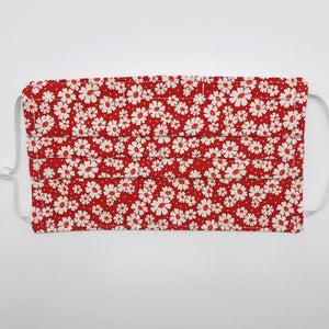 Masks are made of 2 layers of 100% quilting-weight cotton fabric with a 30's retro simple daisy's on red print. . The elastic adjustable ear loops tightened with a craft bead to make them comfortable to fit a wider range of sizes. The masks also have a bendable aluminum nose piece which helps to make a better seal over the wearers face. Machine wash and dry after each use.     7” H x 7.5” W