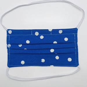 Masks are made of 2 layers 100% batik quilting cotton featuring a white dot on blue print, over the head elastic loops and a bendable aluminum nose. Wash in washing machine and dry in dryer after each use. 7” H x 7.5” W 