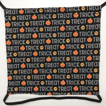 Load image into Gallery viewer, Image of Trick or Treat works and pumpkins on black fabric print.
