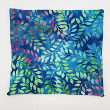 Load image into Gallery viewer, Image of blue, green and purple leaves on a cotton batik fabric. 
